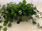 Artificial houseplants in baskets