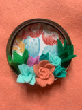 Upcycled lid with handmade felt flowers